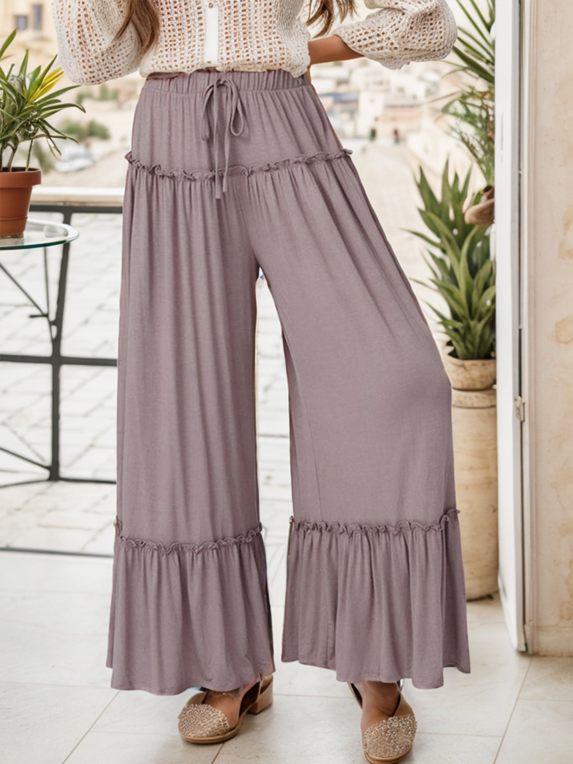 Wide leg ruffle trim pants with tie, slightly stretchy.
