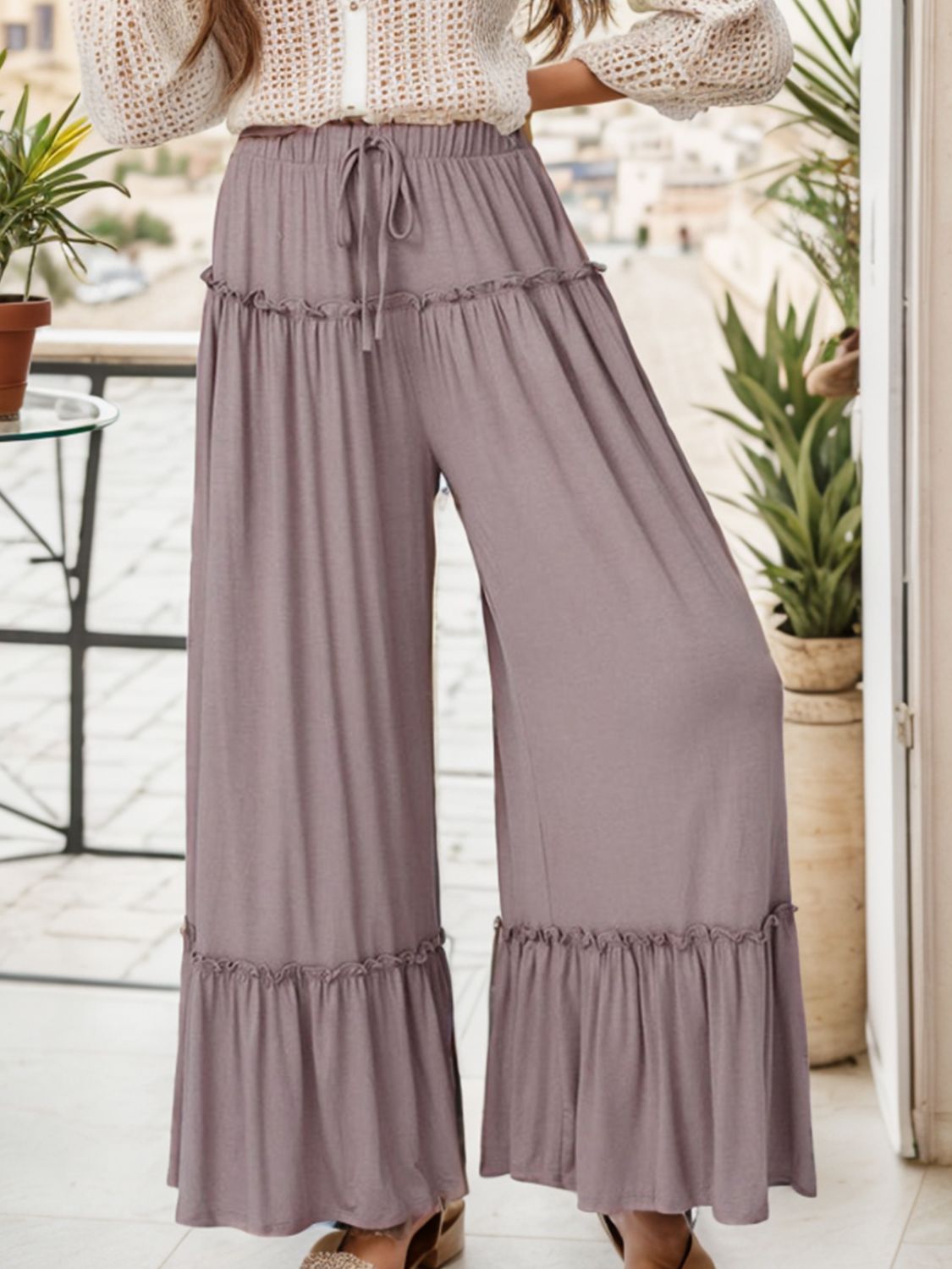 Wide leg ruffle trim pants with tie, slightly stretchy.