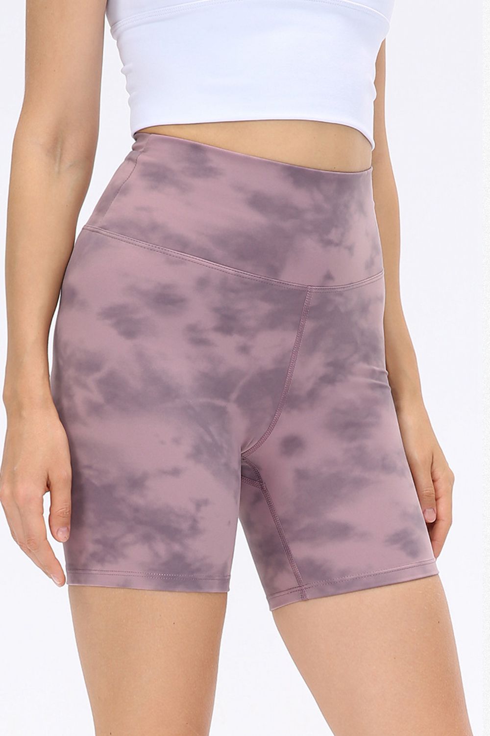Abstract print tie-front shorts with pockets and ruched detail.