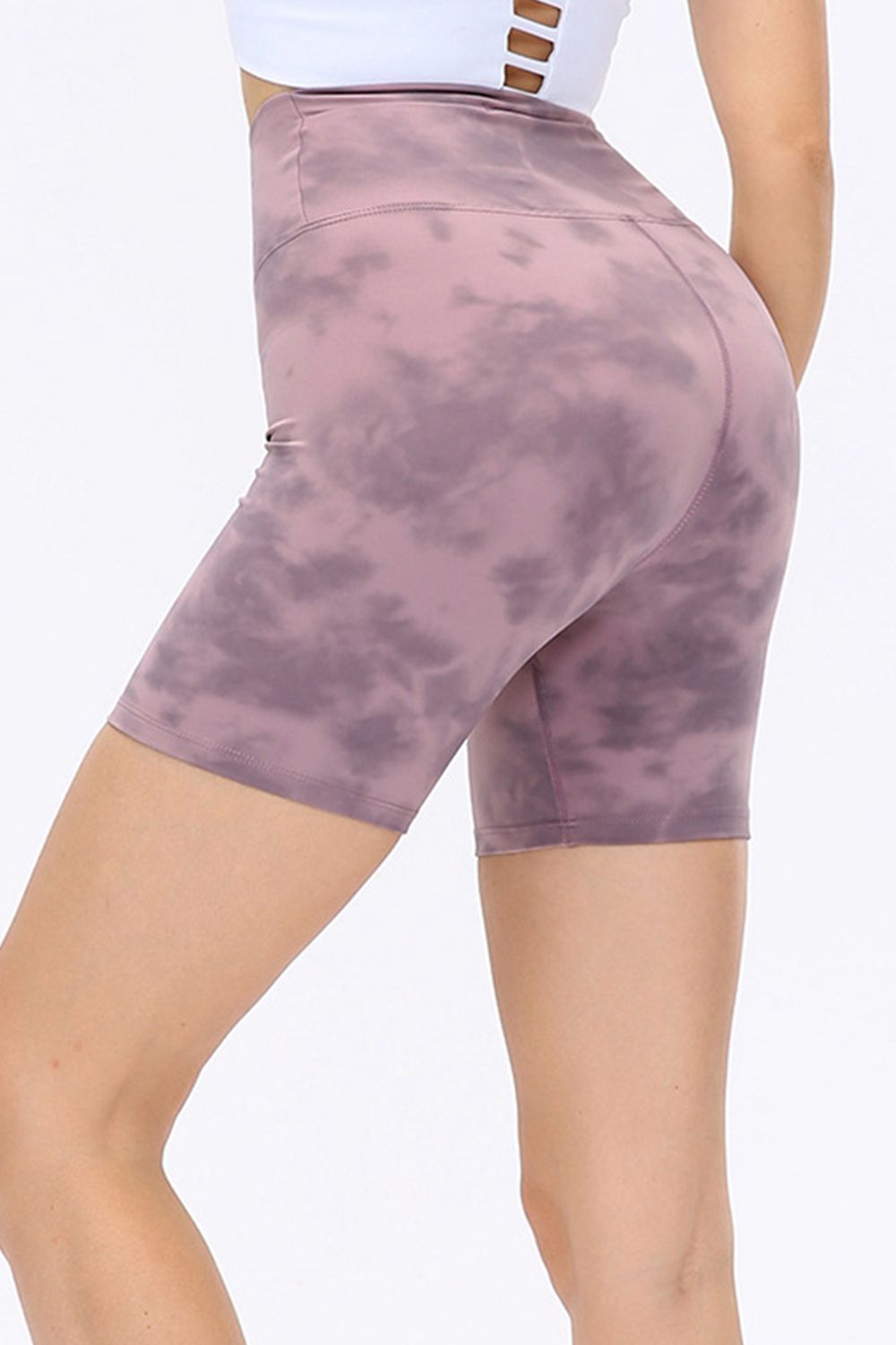 Abstract print tie-front shorts with pockets and ruched detail.