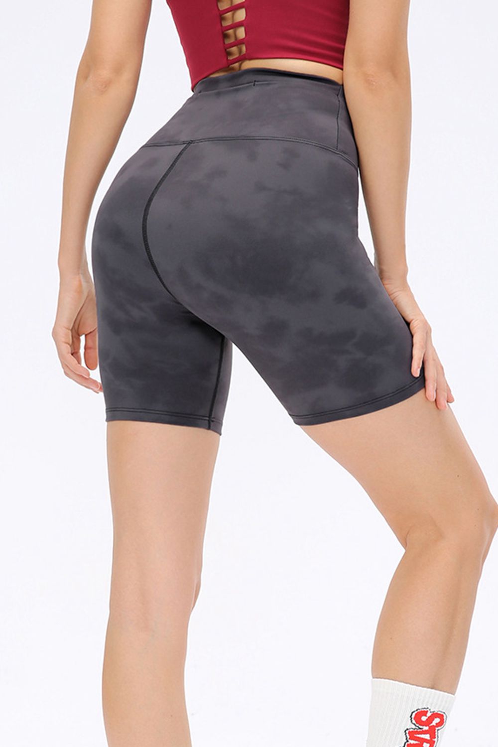 Abstract print tie-front shorts with pockets and ruched detail.