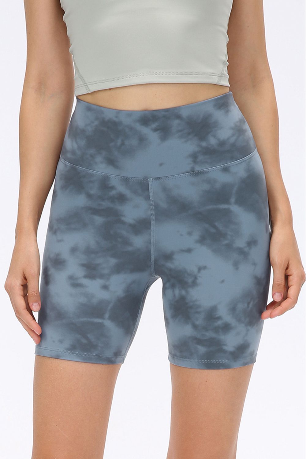 Abstract print tie-front shorts with pockets and ruched detail.