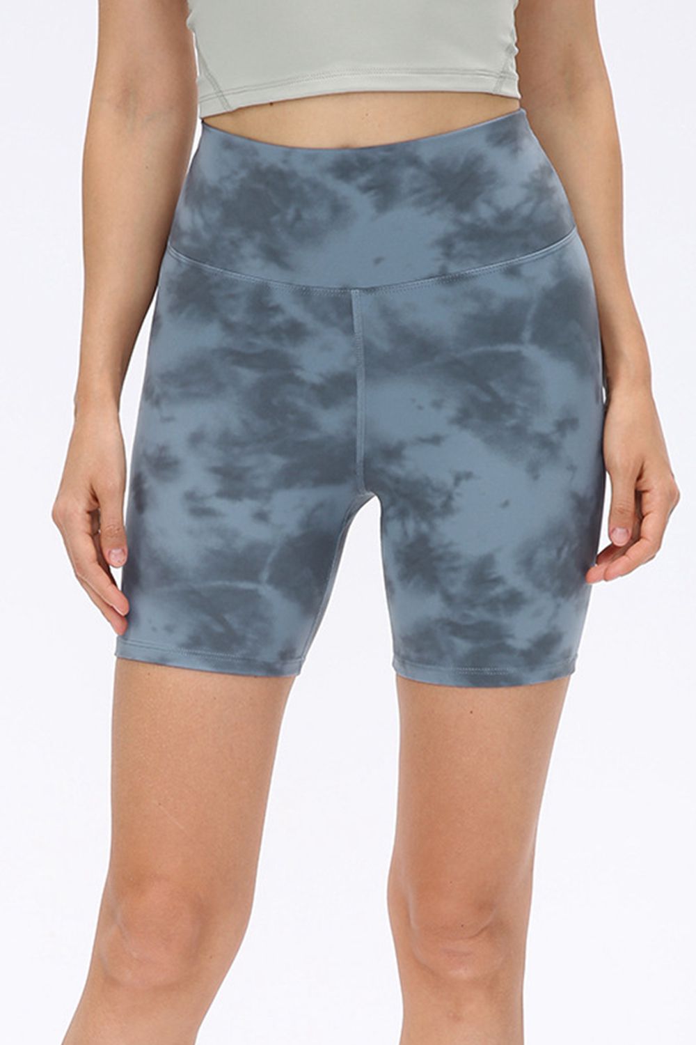 Abstract print tie-front shorts with pockets and ruched detail.