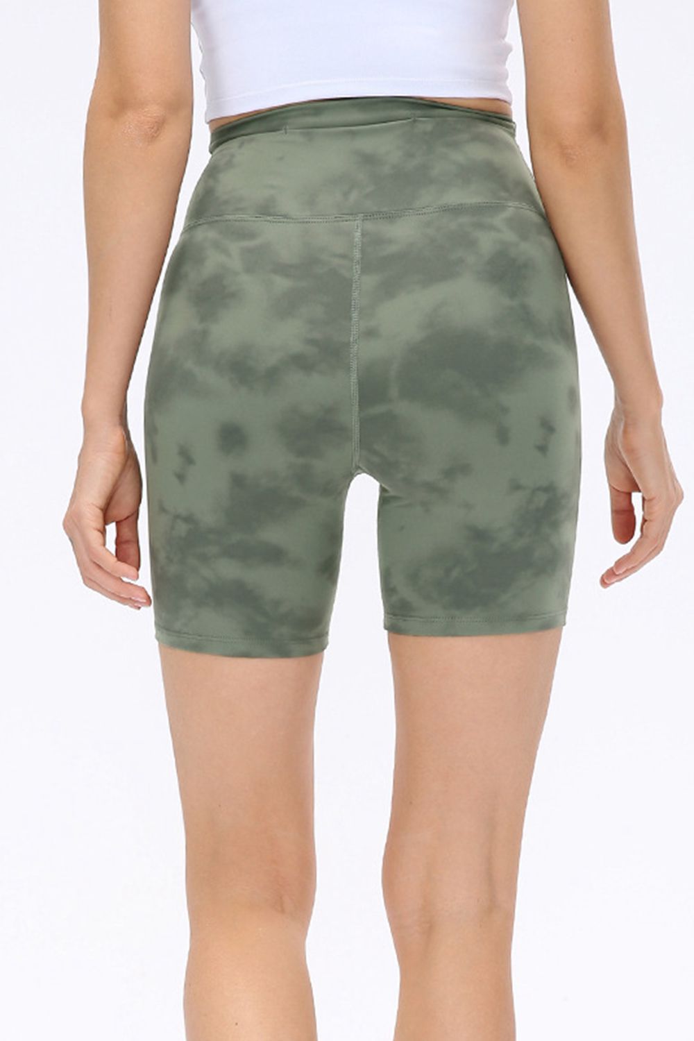Abstract print tie-front shorts with pockets and ruched detail.