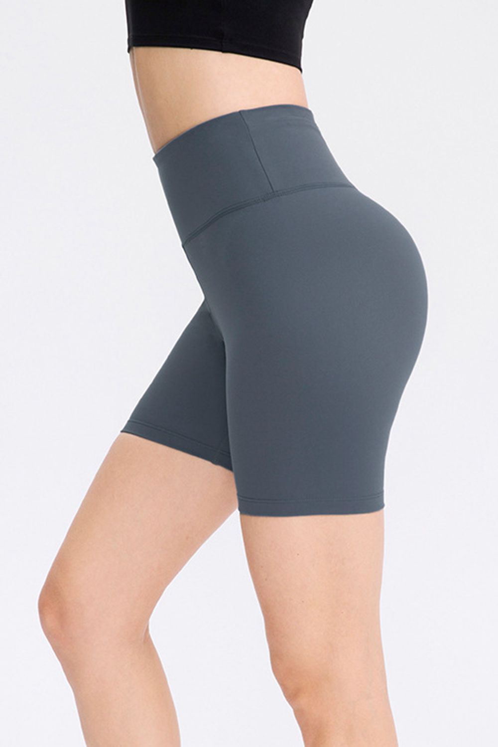 Abstract print tie-front shorts with pockets and ruched detail.