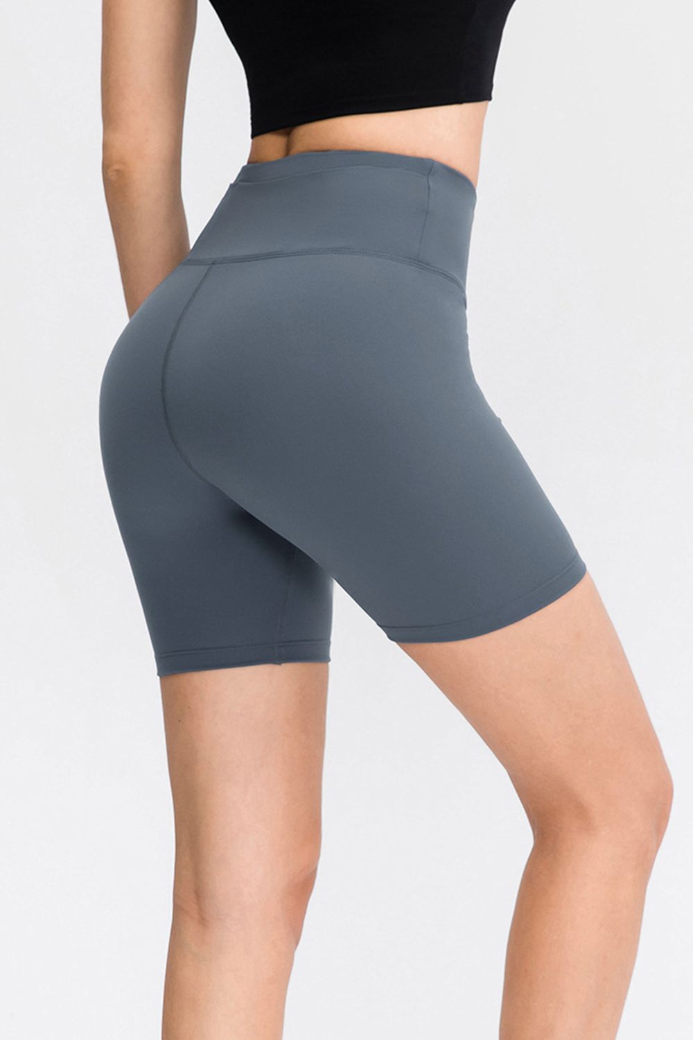 Abstract print tie-front shorts with pockets and ruched detail.