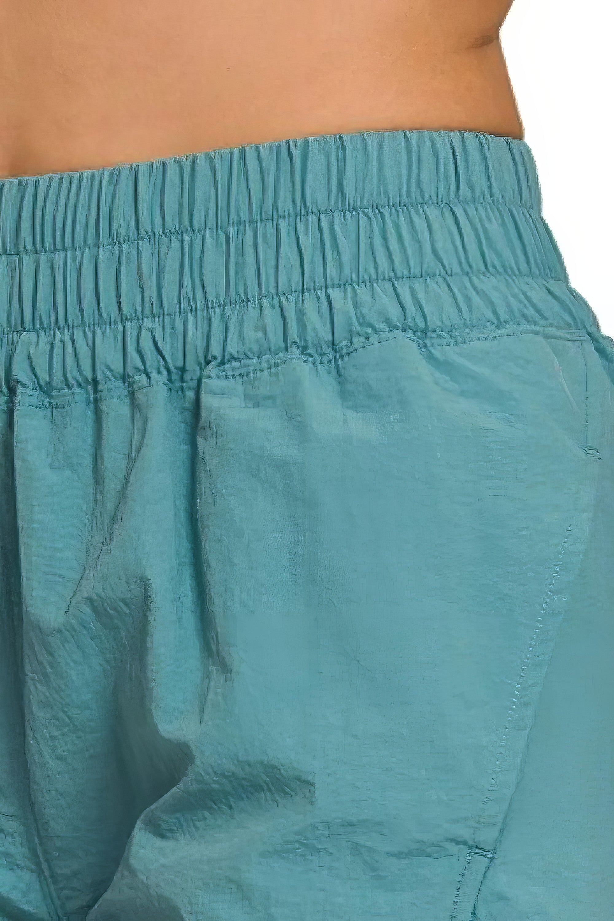 Windbreaker smocked waistband running shorts with slit, breathable, lightweight, and pockets.