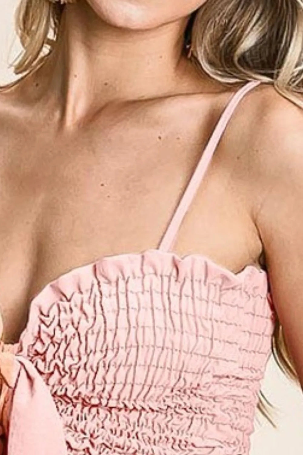 Woven color block smocked with ribbon bra top with tied ruffles, moderately stretchy.