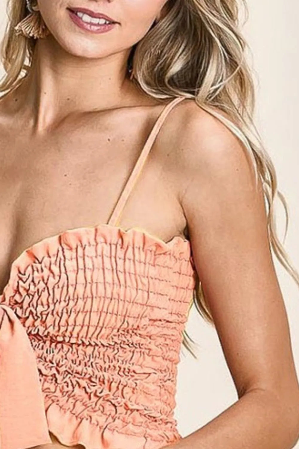 Woven color block smocked with ribbon bra top with tied ruffles, moderately stretchy.