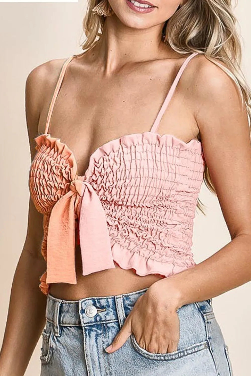 Woven color block smocked with ribbon bra top with tied ruffles, moderately stretchy.