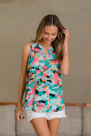 Wrinkle-free floral notched tank, opaque and slightly stretchy.