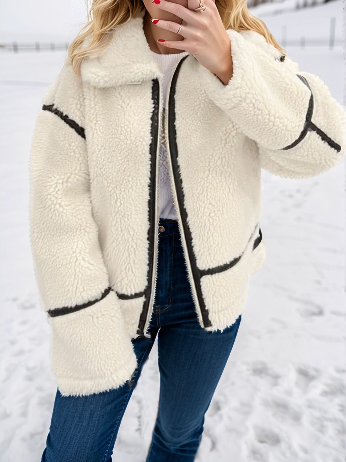 Zip up long sleeve sherpa jacket with pockets and lined body.