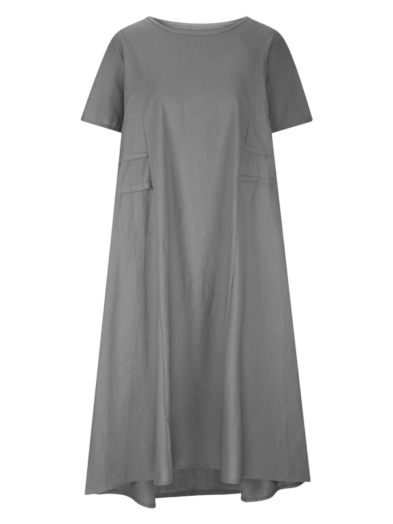 Plus size loose midi dress with short sleeves and pockets shown in cream and black by the beach