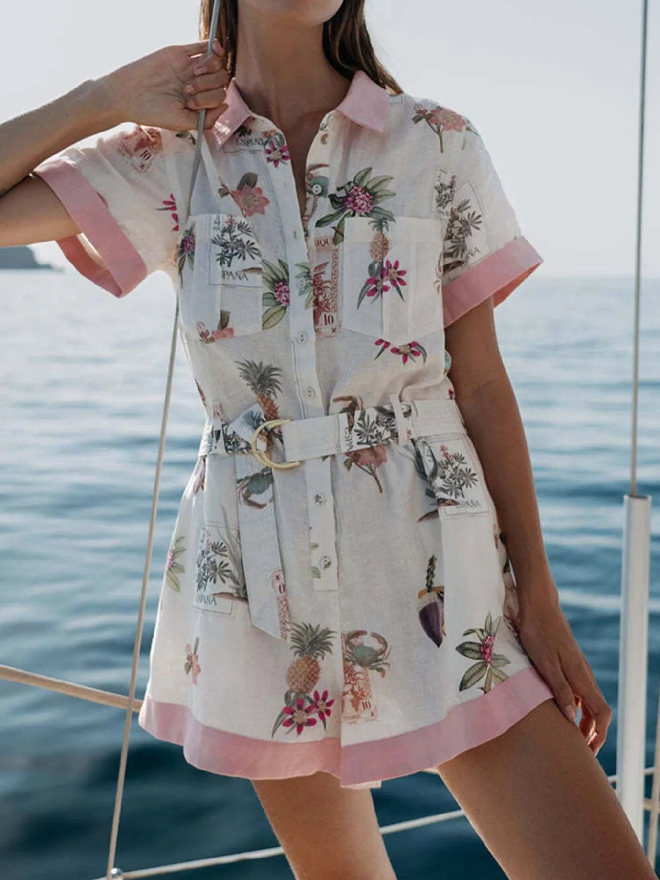 Printed Short Sleeve Romper with Belt and Pockets.