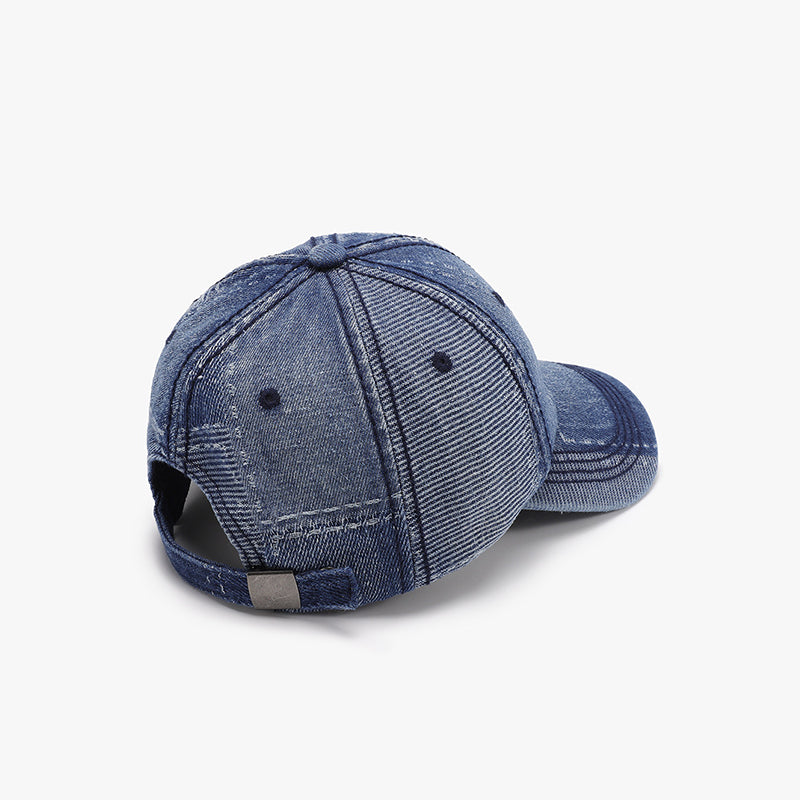 Blue adjustable cotton baseball cap shown from the back, featuring a structured six-panel crown, curved brim, ventilation eyelets, and an adjustable strap.