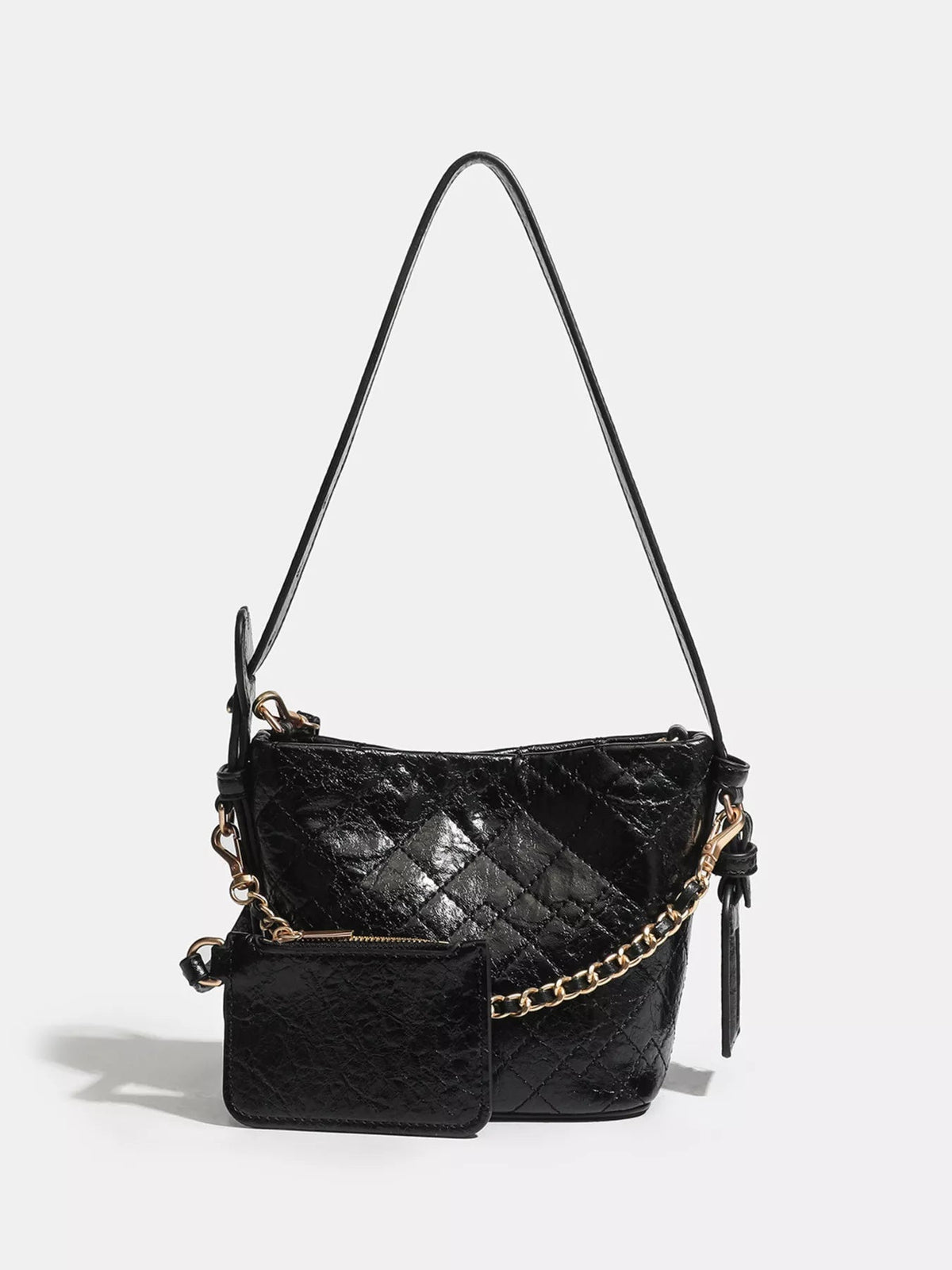 Small black PU leather bucket bag with an adjustable strap, quilted construction, gold-tone chain detail, and a matching front pouch.