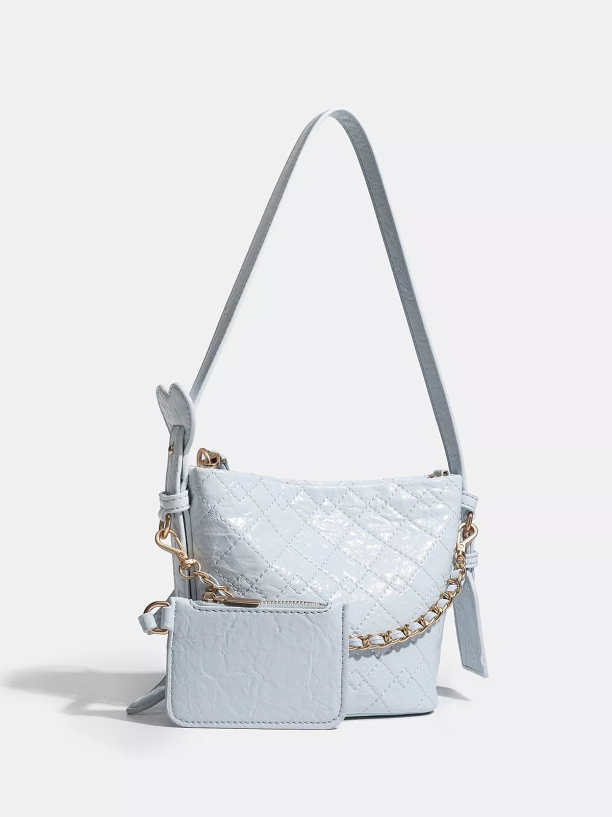 Small light blue quilted PU leather bucket bag with an adjustable strap, gold-tone chain detail, and a front zip pouch.