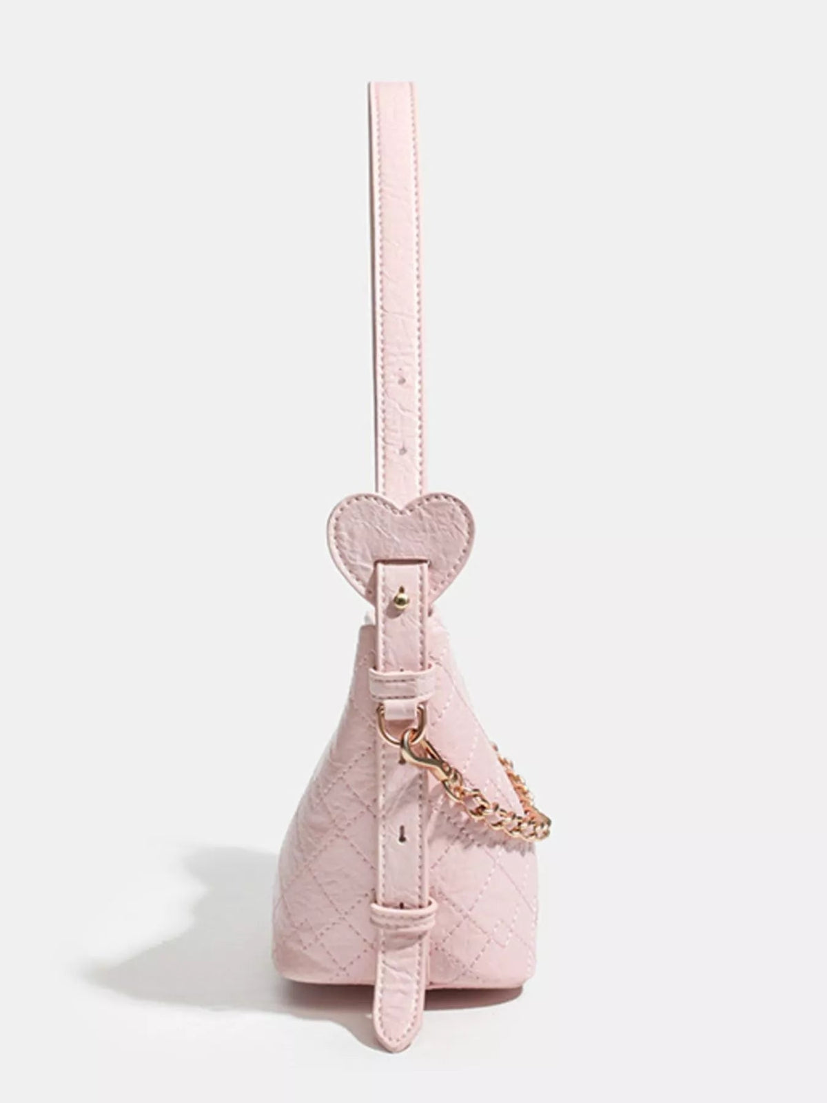 Small pink PU leather bucket bag with quilted construction, an adjustable strap, heart-shaped accent, and gold-tone chain hardware.