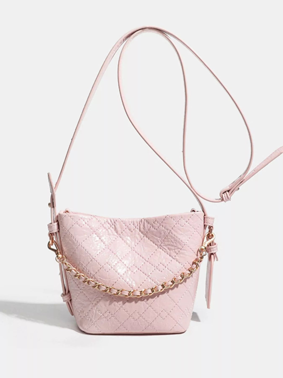 Small pink PU leather bucket bag with quilted diamond construction, an adjustable shoulder strap, gold-tone hardware, and a decorative chain accent.