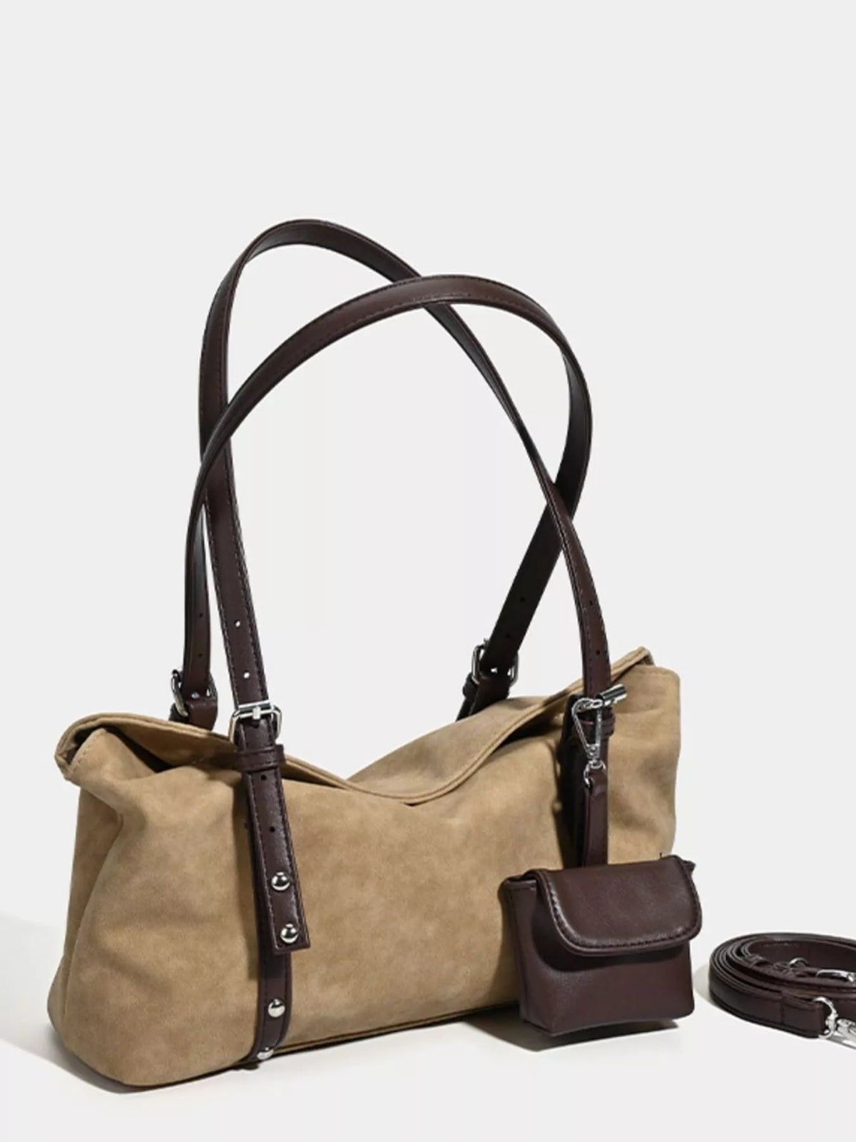Medium tan suede shoulder bag with a soft structured silhouette, dark brown adjustable straps, open top, attached pouch, and a detachable long strap.