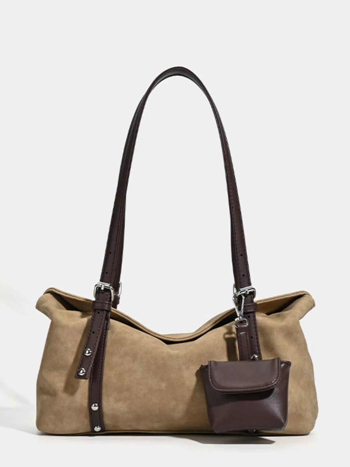 Medium tan suede shoulder bag with adjustable dark brown straps, a soft slouchy silhouette, silver hardware, and a front pouch pocket.