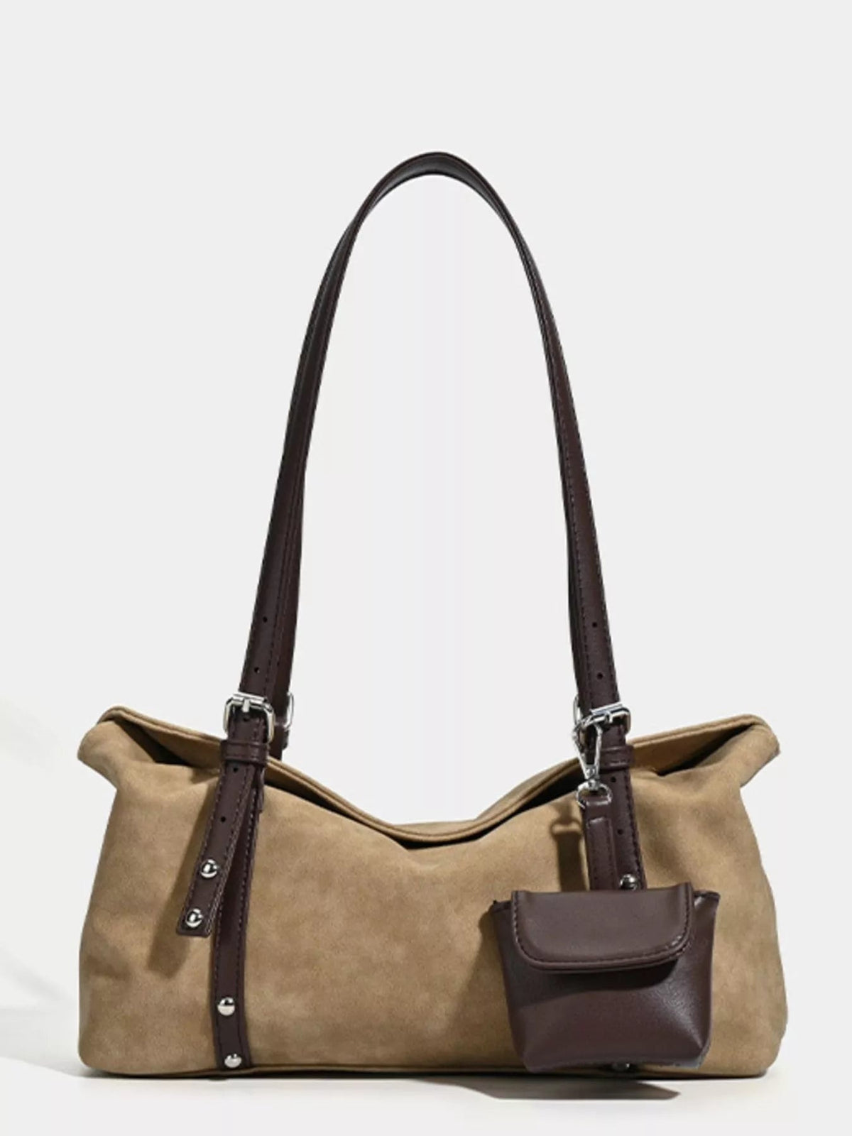 Medium tan suede shoulder bag with a slouchy silhouette, dark brown adjustable straps, silver buckles, and a coordinating front pouch.