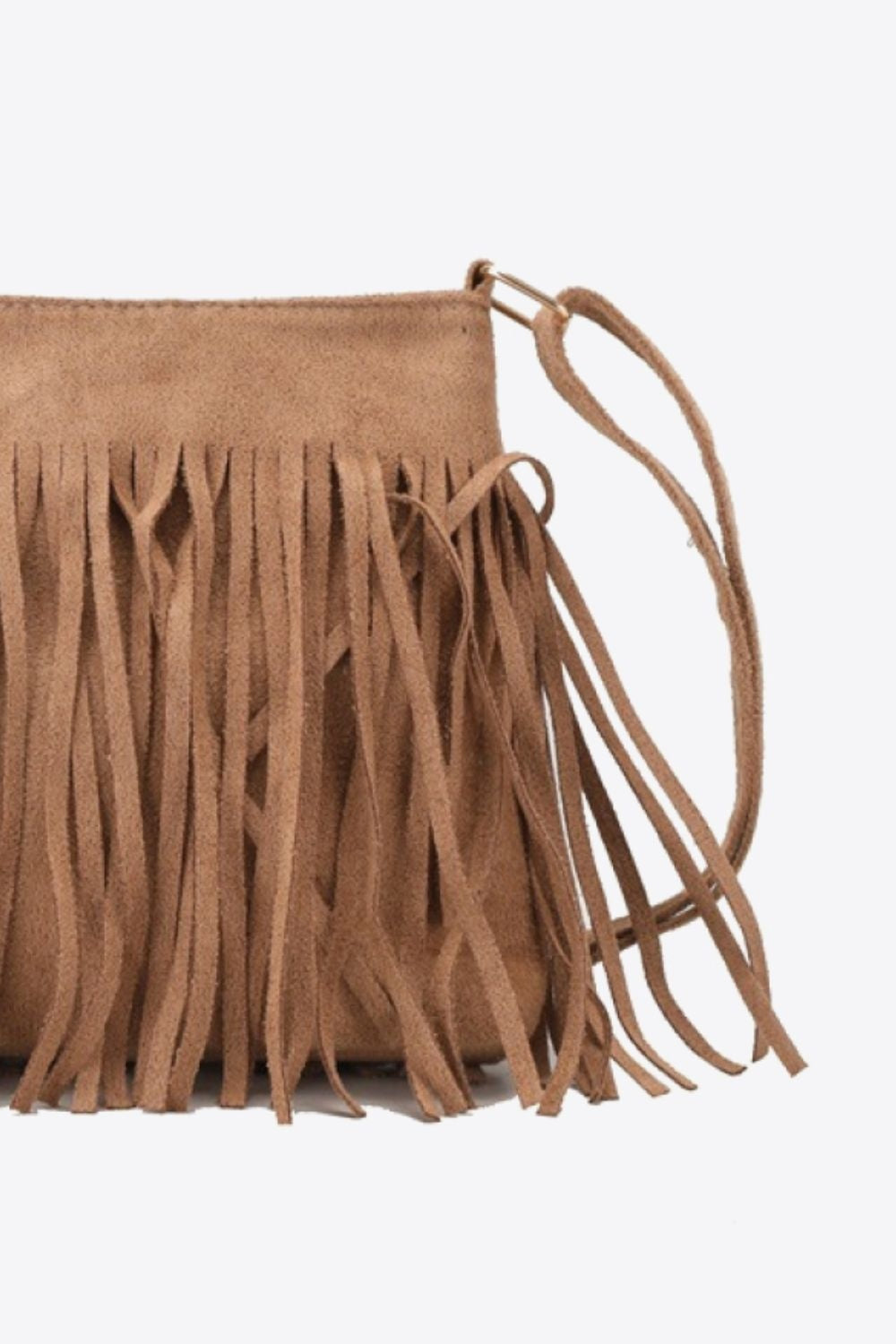 A tan PU leather crossbody sling bag with a compact rectangular silhouette, thin strap, and long layered fringe detailing along the front and sides.