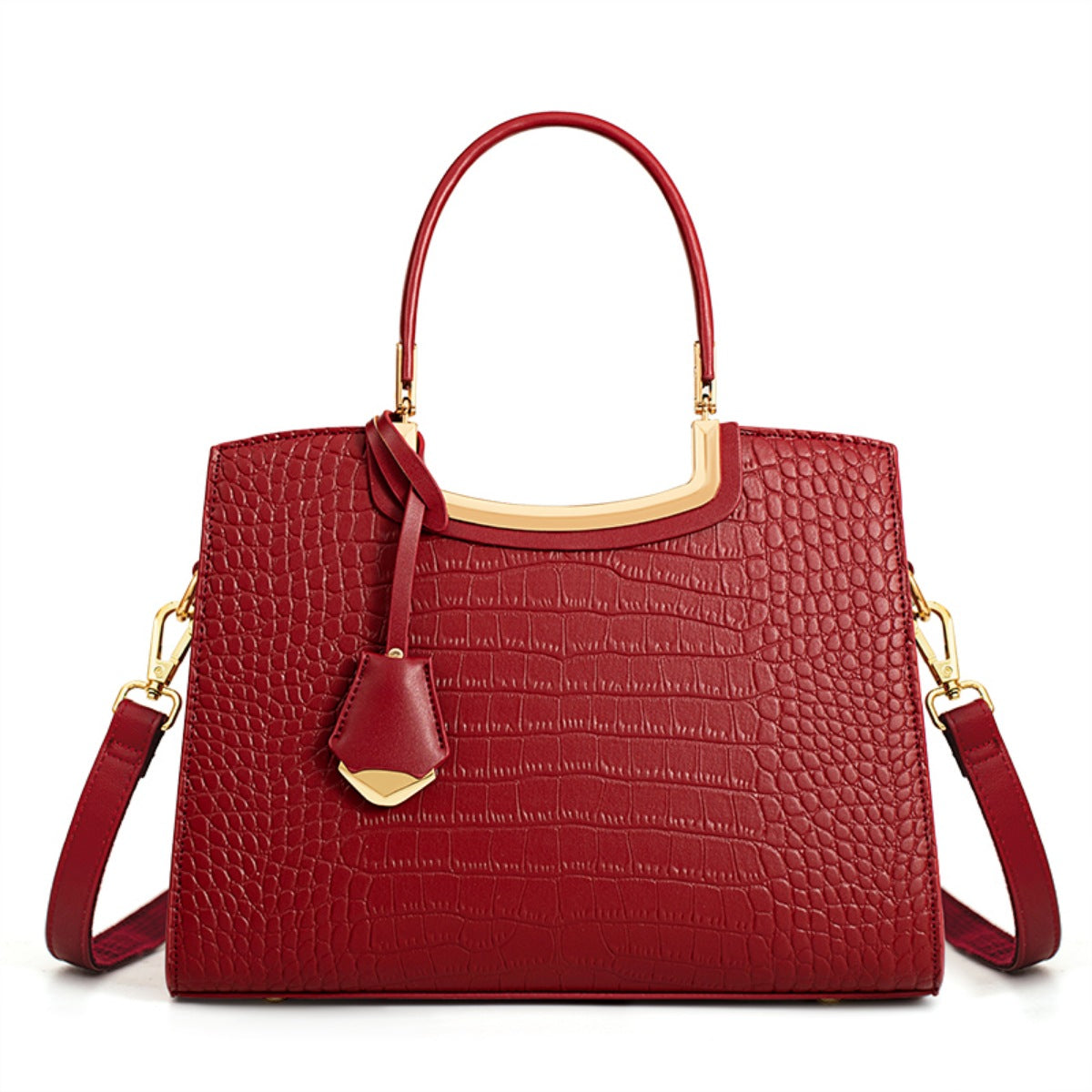 Medium red crocodile-embossed PU leather top-handle handbag with a structured silhouette, gold-tone hardware, decorative tag, and shoulder strap.
