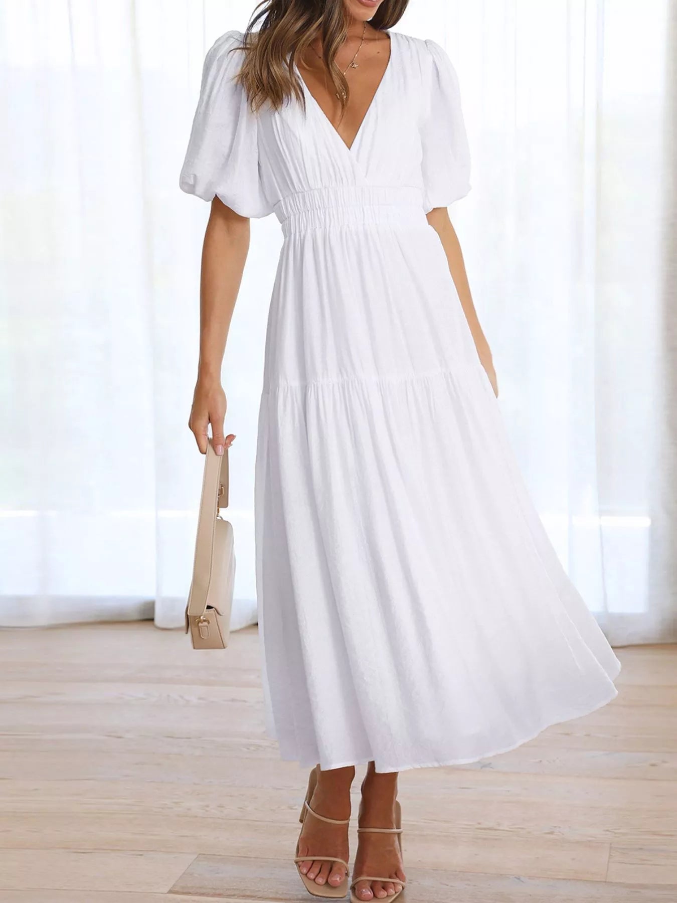 Cream tiered midi dress with a V-neck, smocked waist, and short puff sleeves