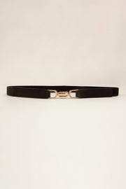 Slim black elastic belt with a textured PU finish, visible stitched edges, and a polished alloy interlocking buckle.