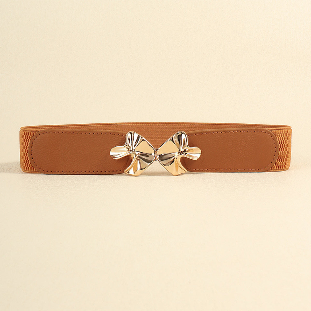Brown PU elastic belt with a wide, streamlined silhouette, stitched edges, and a sculptural gold-tone alloy buckle centered at the waist.
