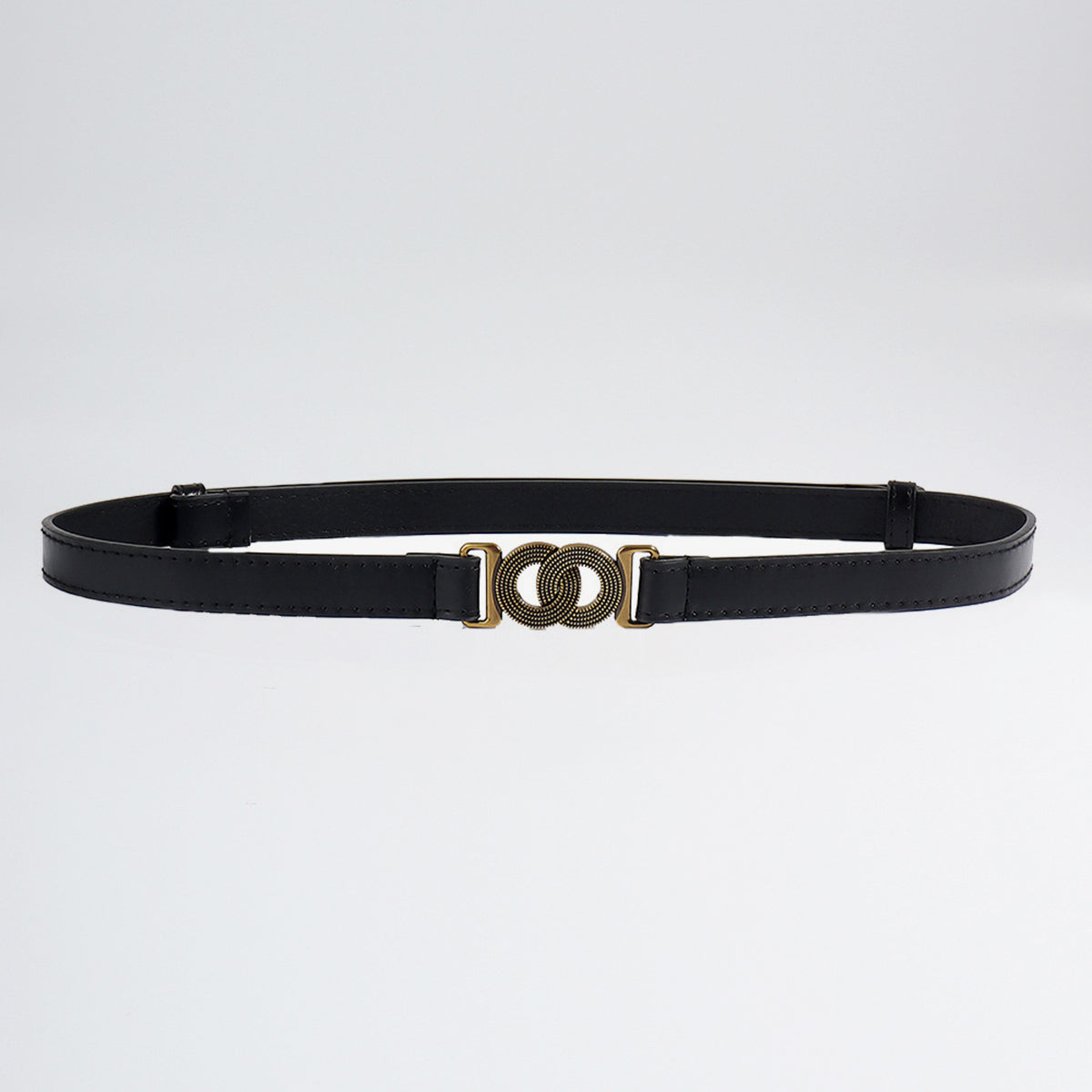A slim black PU belt with clean edging and a distinctive alloy buckle featuring interlocking circular rings.