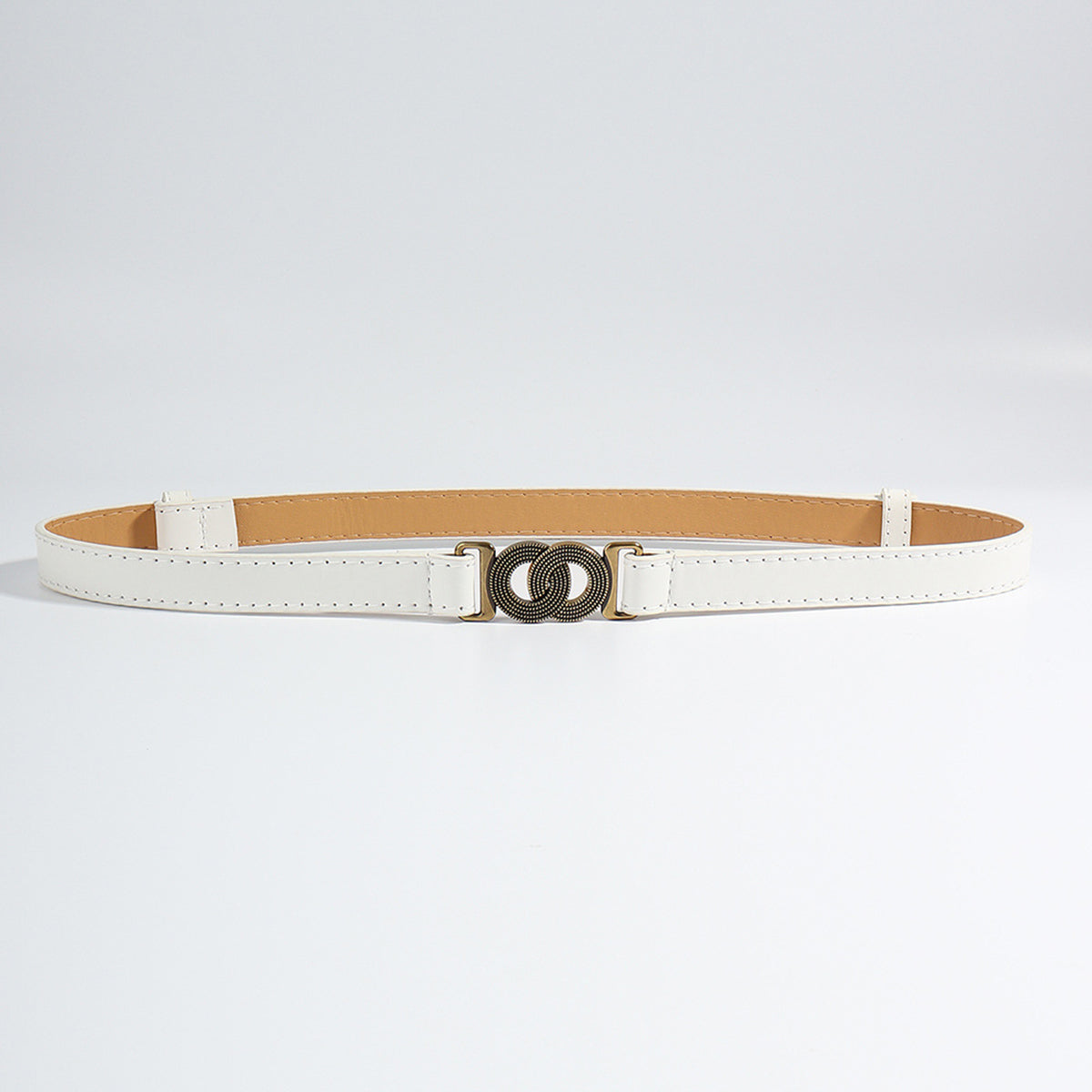A slim white PU belt with clean stitched edging and a distinctive alloy buckle featuring an interlocking circular motif.