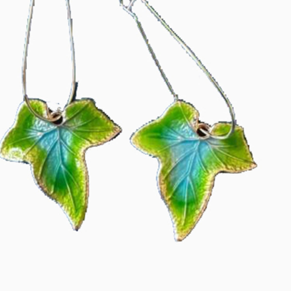 Alloy leaf drop earrings feature elongated green and blue leaf silhouettes with visible veining and slim wire hooks for a graceful, nature-inspired finish.