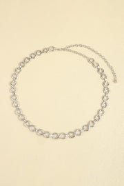 Silver alloy chain belt featuring repeating linked-circle details, a delicate 0.8-inch profile, and a fine chain extension with lobster clasp.