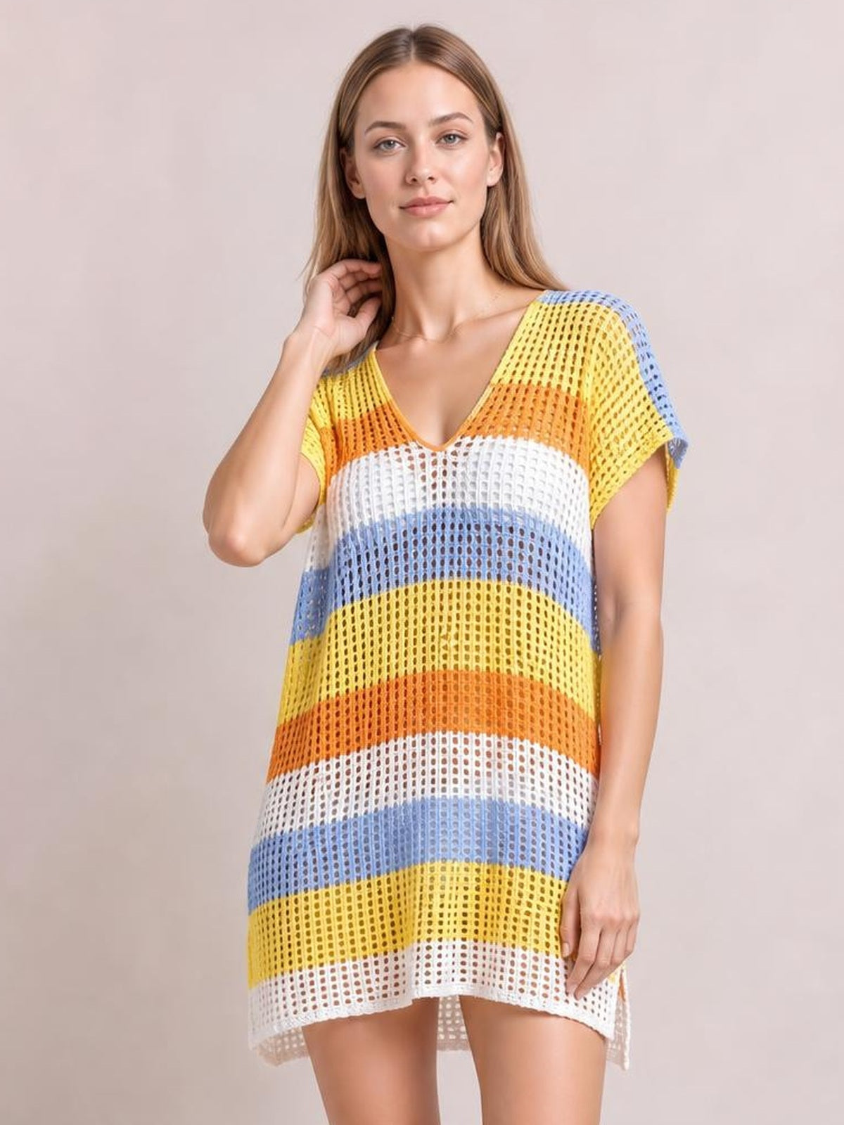 Model wears a colorful striped V-neck short-sleeve cover-up with semi-sheer openwork, a relaxed straight silhouette, and a slightly longer back hem.