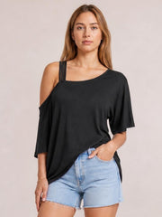 Model poses in a black asymmetrical neck half sleeve T-shirt with a relaxed oversized silhouette and exposed left shoulder.