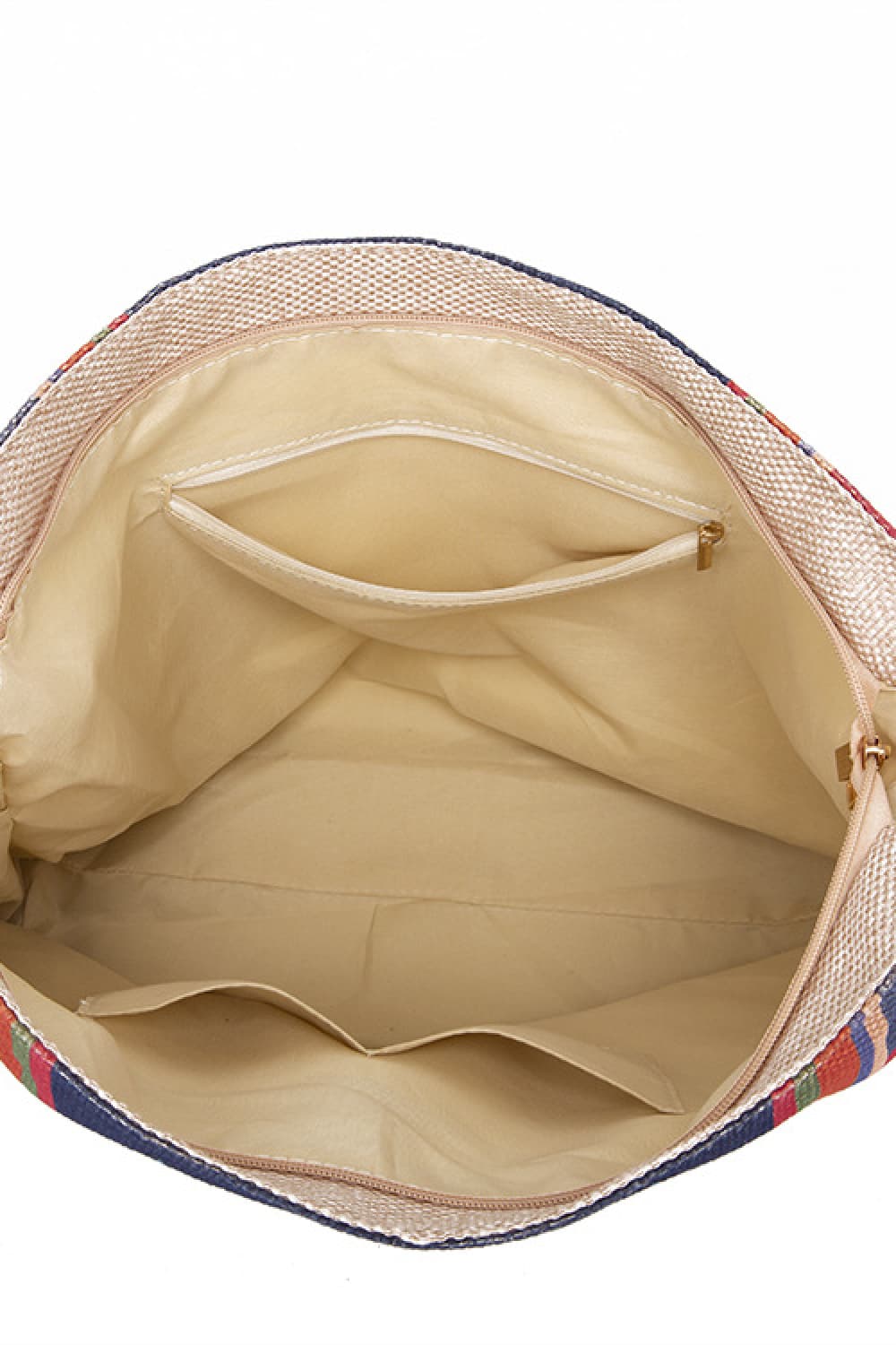 Open oversized geometric canvas tote bag in beige with a colorful striped exterior, spacious lined interior, and an interior zippered pocket.