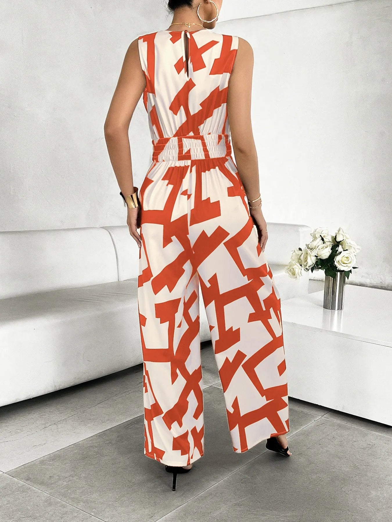 Printed Wide Leg Jumpsuit with Tie and Pockets.