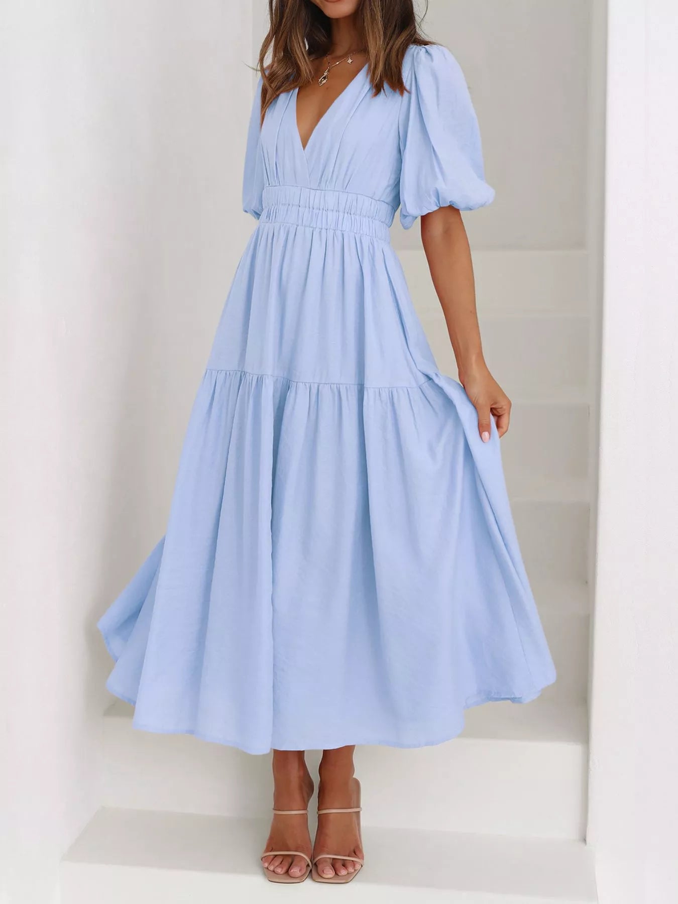 Cream tiered midi dress with a V-neck, smocked waist, and short puff sleeves
