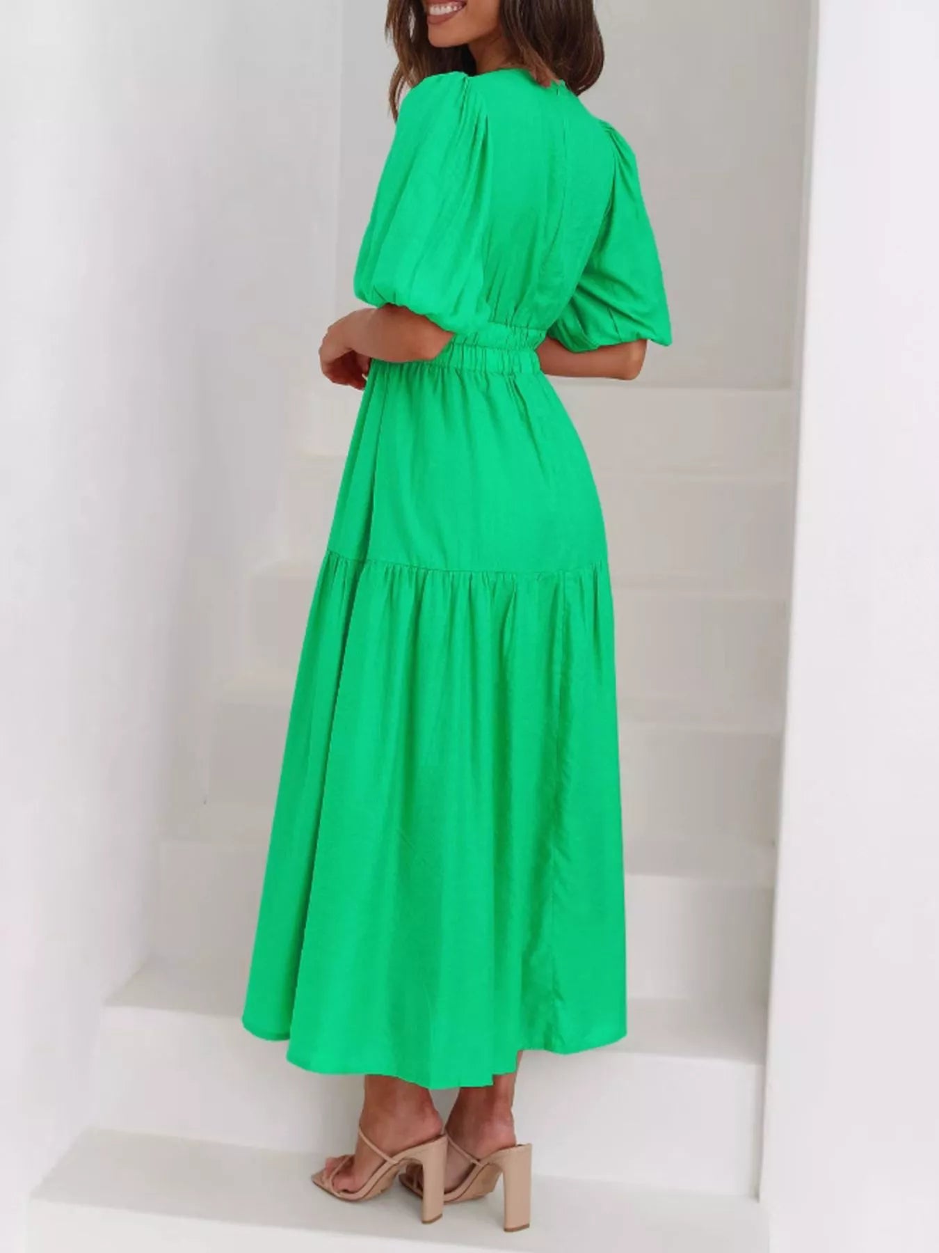 Cream tiered midi dress with a V-neck, smocked waist, and short puff sleeves