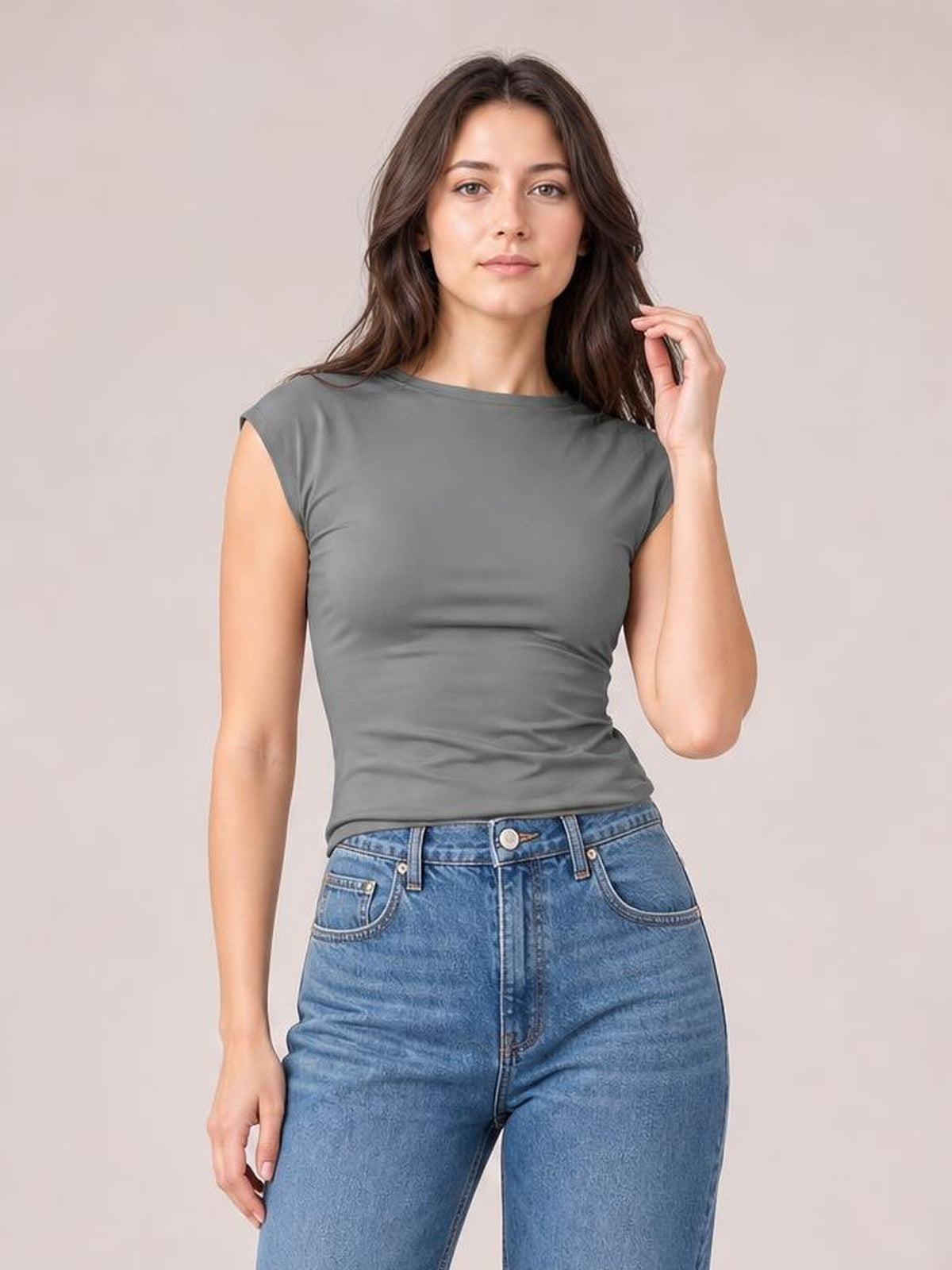 Model poses in a solid gray cropped blouse with a round neck, short regular sleeves, and a fitted silhouette.
