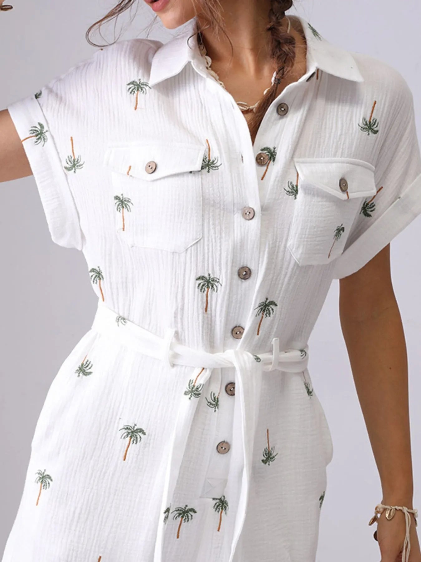 Palm Tree Print Short Sleeve Button-Up Romper with Belt and Pockets.