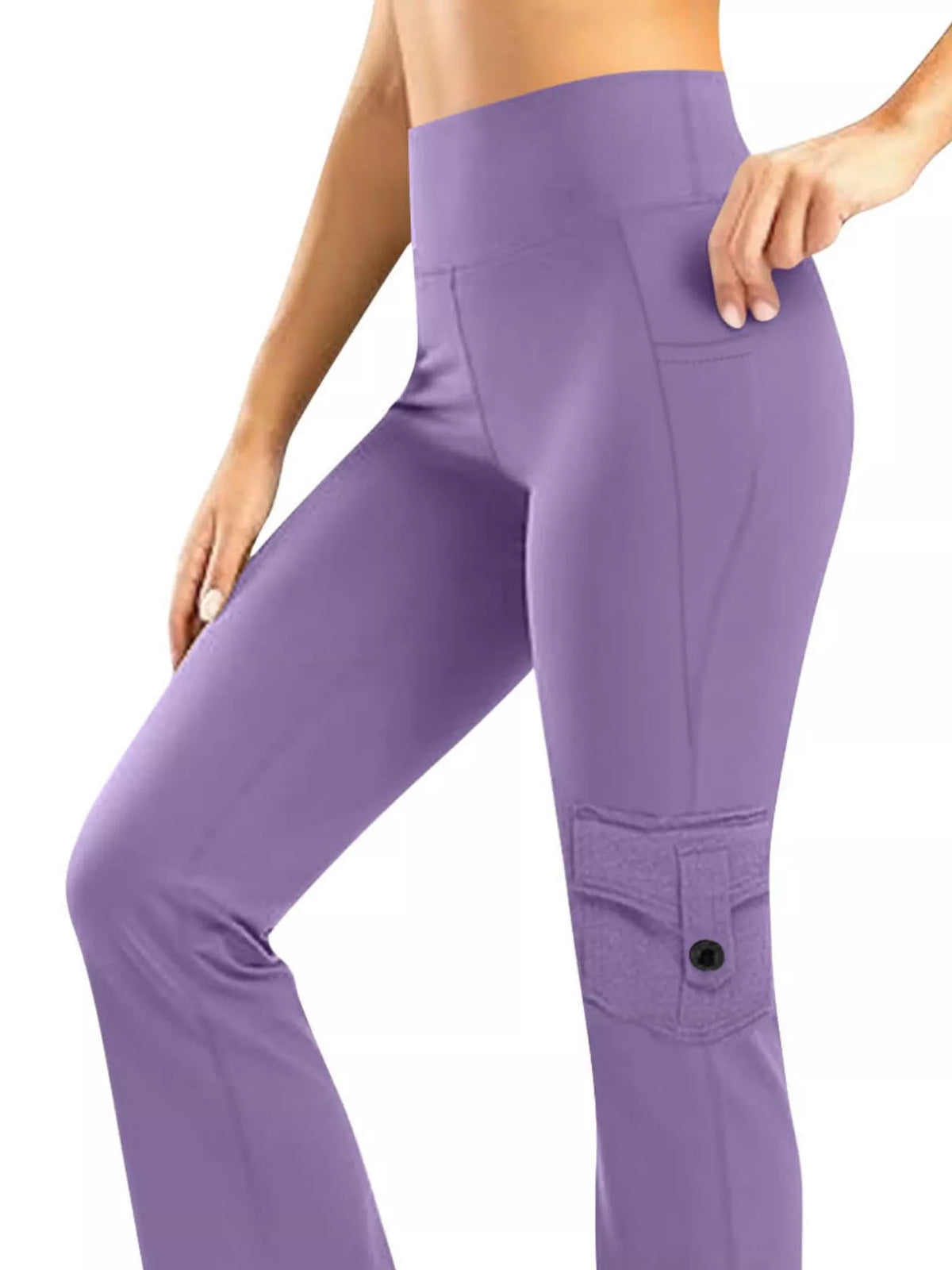 Model wears purple high-waisted yoga pants with a slim straight-leg silhouette, stitched patch pockets, and one leg bent in a relaxed pose.