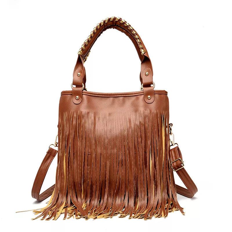 A medium brown PU leather handbag with long layered fringe, dual top handles, and an adjustable detachable shoulder strap.