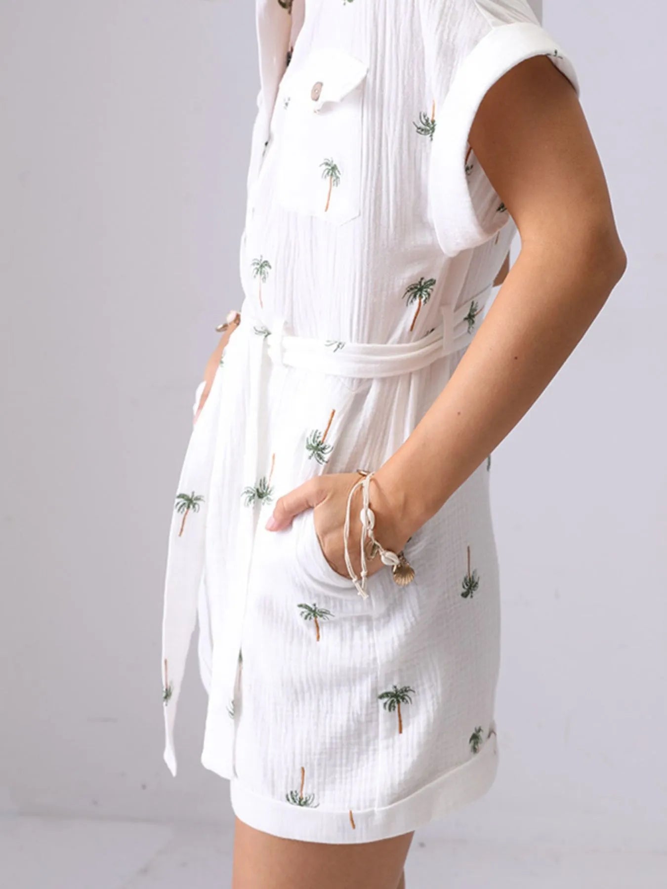 Palm Tree Print Short Sleeve Button-Up Romper with Belt and Pockets.