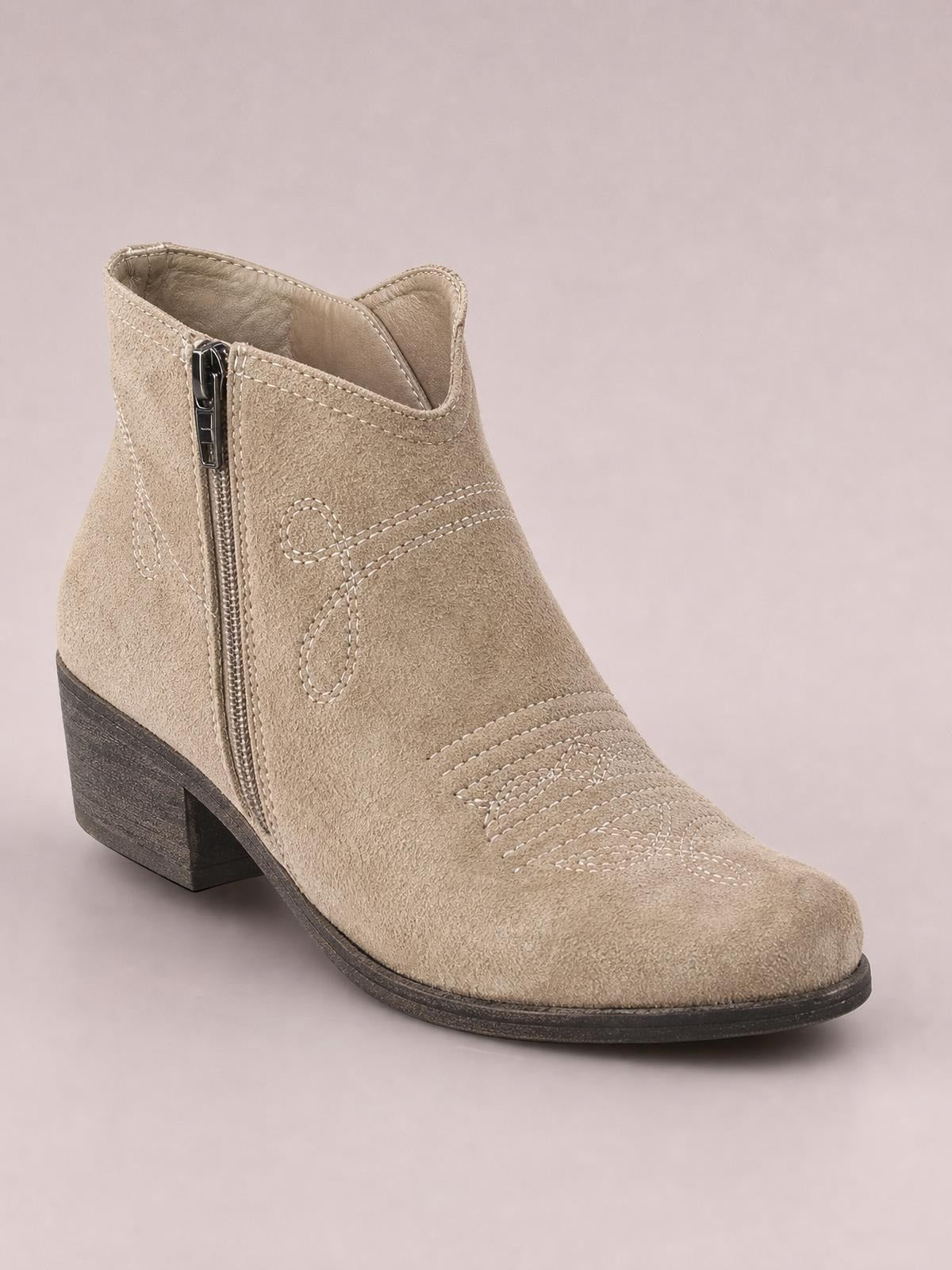 A taupe PU leather ankle boot with a rounded toe, side zipper, decorative stitched detailing, and a sturdy mid-height block heel.
