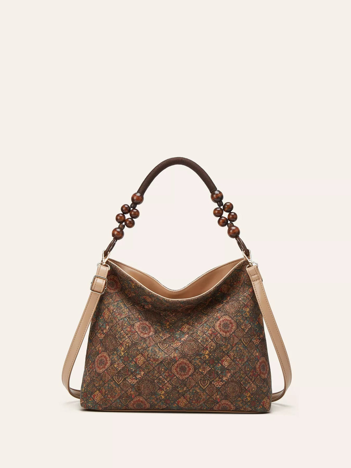 A medium bohemian geometric-pattern hobo handbag in brown and teal features a slouchy silhouette, tan PU leather trim, beaded handle, and shoulder strap.