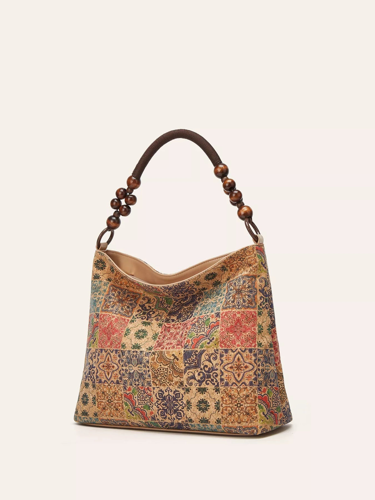 Medium bohemian geometric pattern hobo handbag in colorful patchwork PU leather, with a slouchy silhouette, curved opening, and rounded beaded handle.
