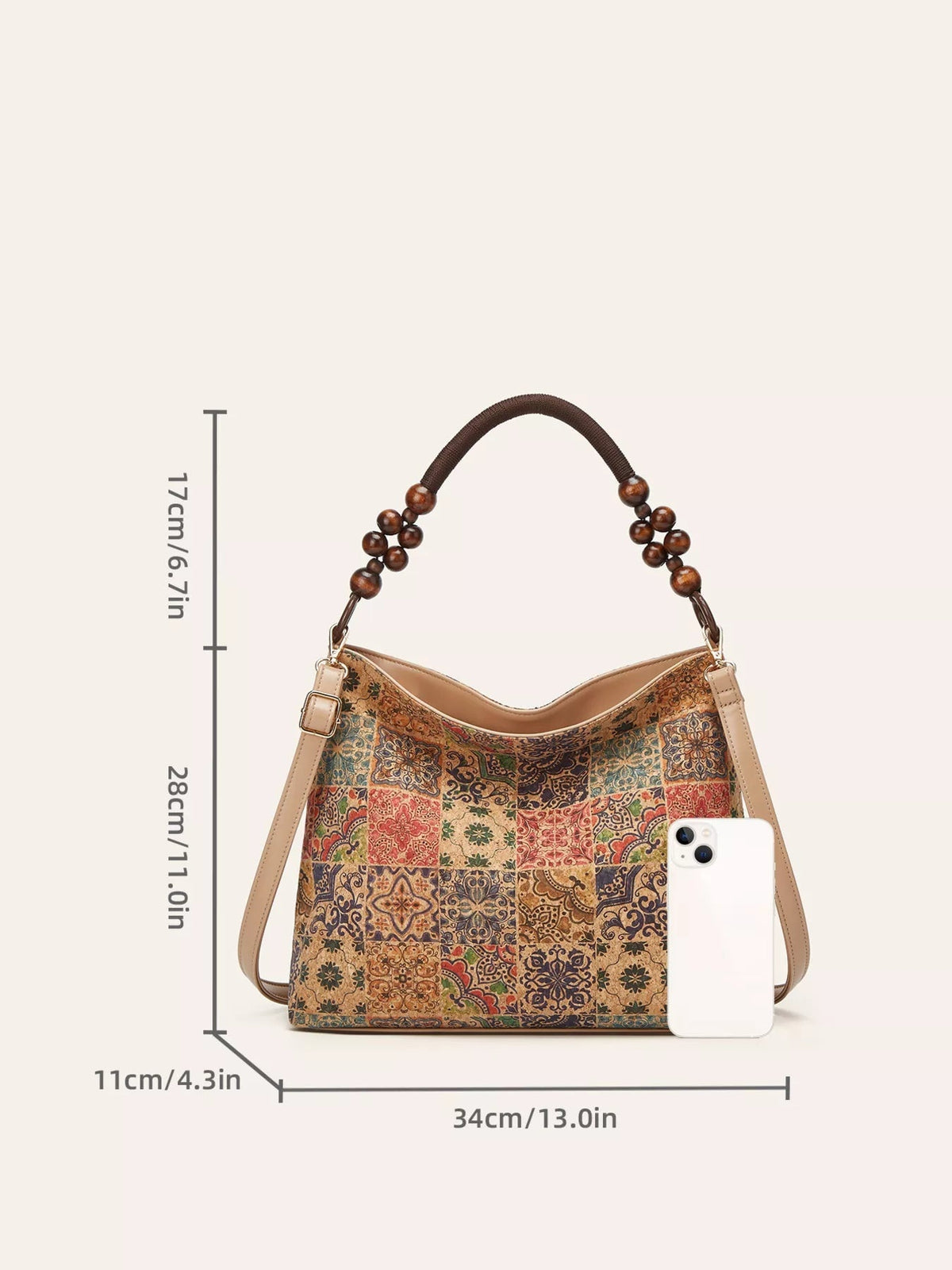 Medium PU leather bohemian hobo handbag with a colorful geometric patchwork pattern, slouchy silhouette, tan trim, beaded top handle, and shoulder strap.